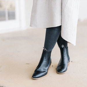 women wearing charcoal merino wool tights