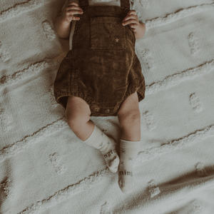 Merino Wool Crew Socks | BABY | Fox worn by a baby in brown corduroy overalls on a textured blanket.