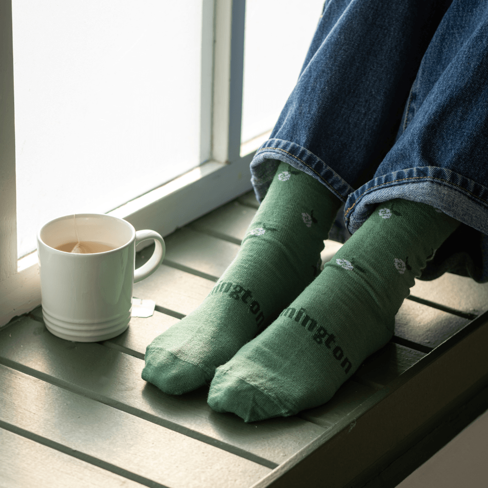 Lamington women's merino roll top crew socks in sage green with natural floral pattern made in New Zealand.