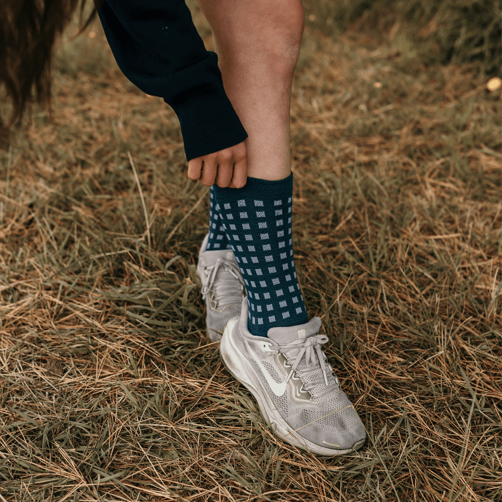 Merino Wool Crew Socks for Women in deep teal with light blue grid pattern, stylish and versatile for everyday use.