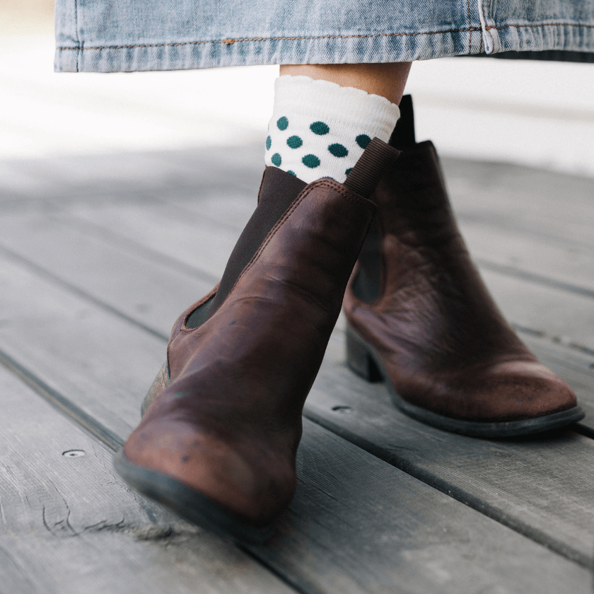 lady wearing cream socks with green spots merino wool nz