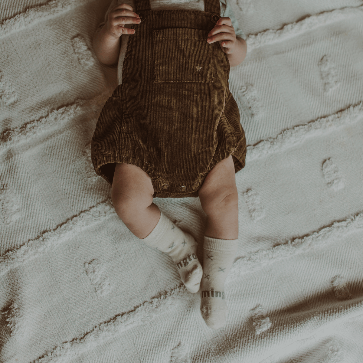 Merino Wool Crew Socks | BABY | Fox worn by a baby in brown corduroy overalls on a textured blanket.