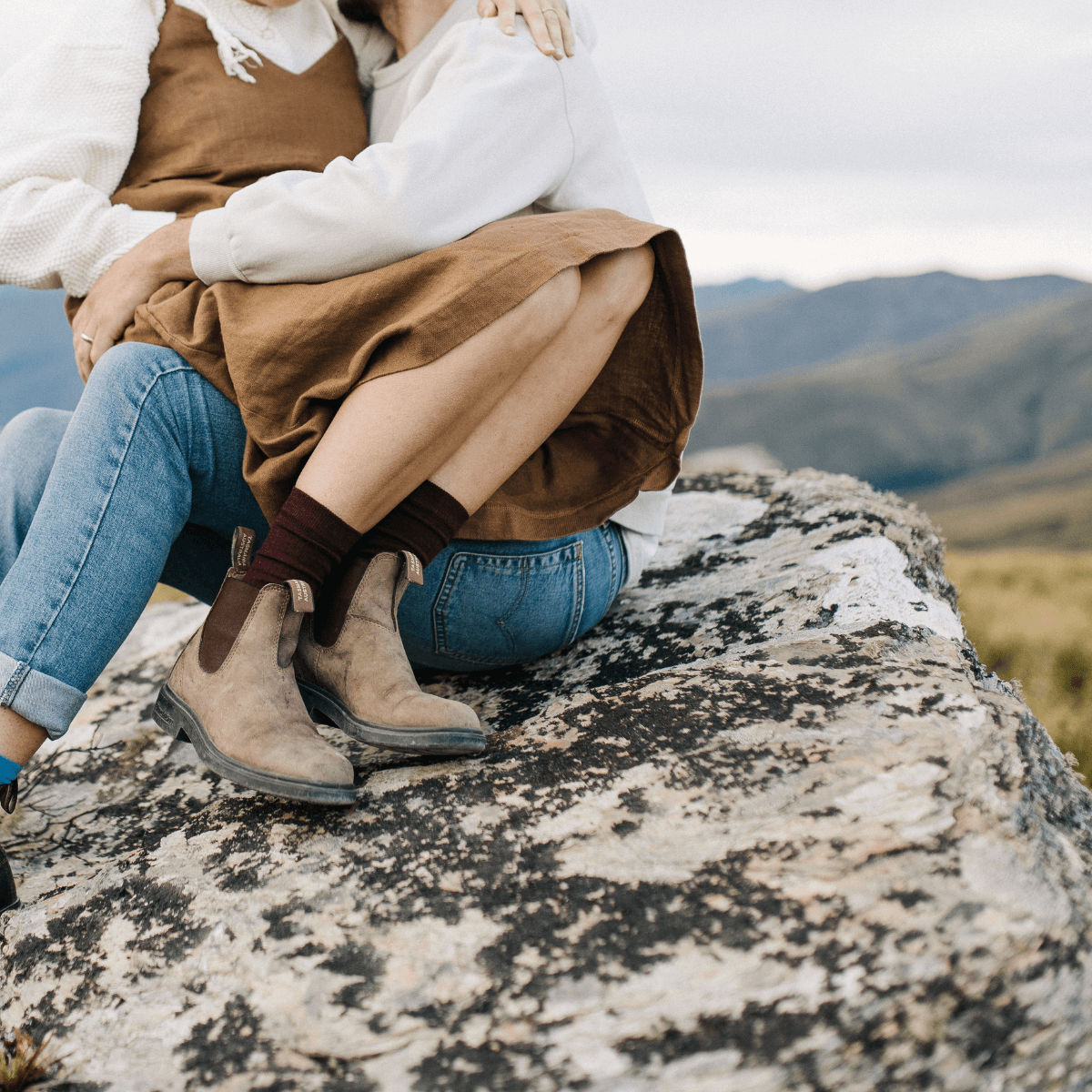 Merino Wool Crew Socks | WOMAN | Fig shown in a scenic outdoor setting with stylish footwear.